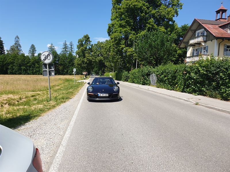 Porsche 911 Carrera Cabriolet on a quiet Bavarian country road