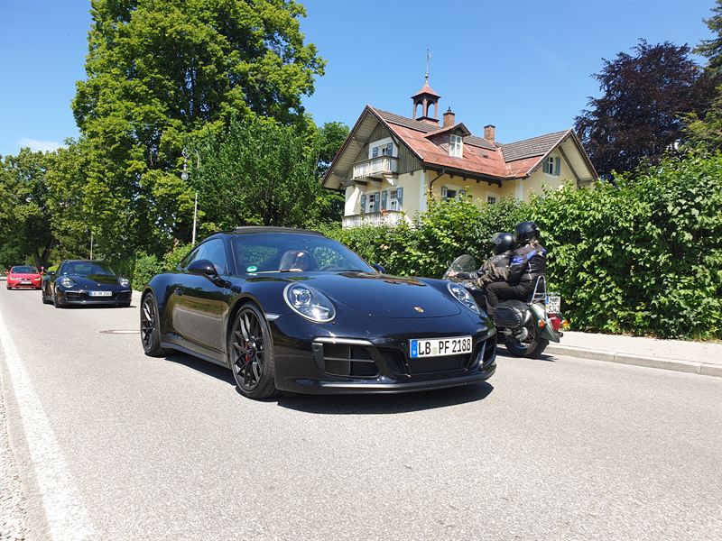 Porsche 911 on a Bavarian country road — close detail