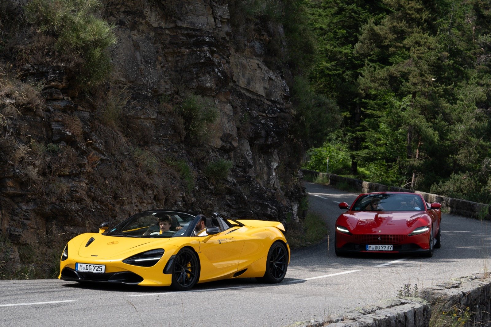 Group of supercars on a French Riviera mountain road